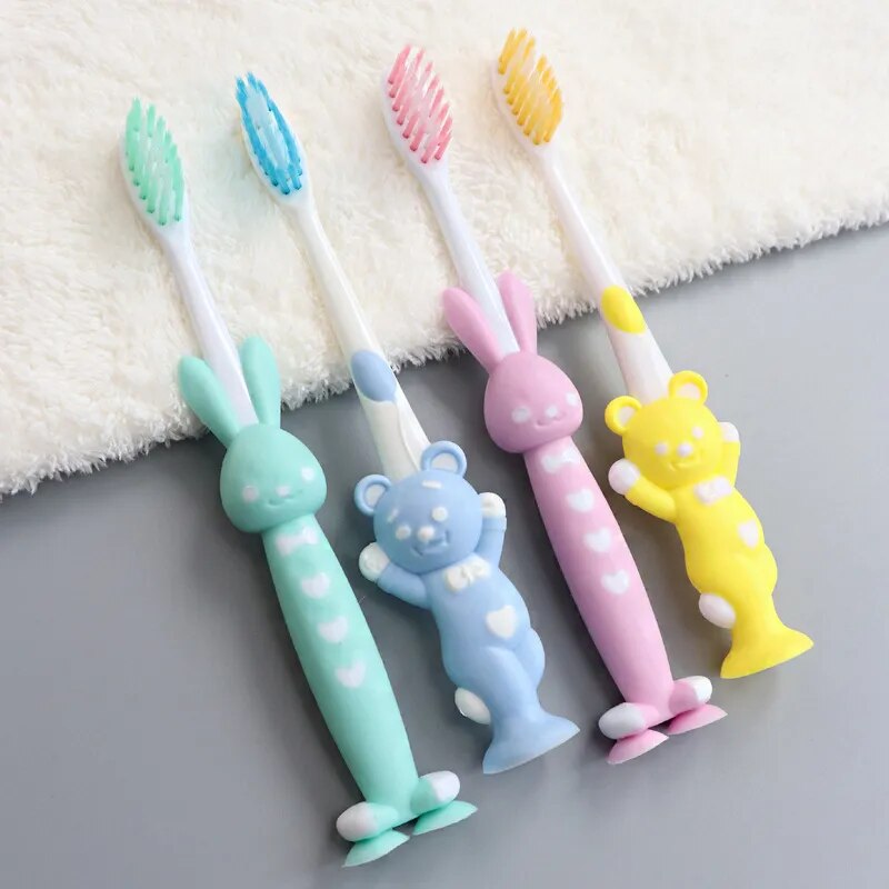 Set of 4 cute rabbit and bear design toothbrushes for gentle dental care ideal for training young children to brush their teeth