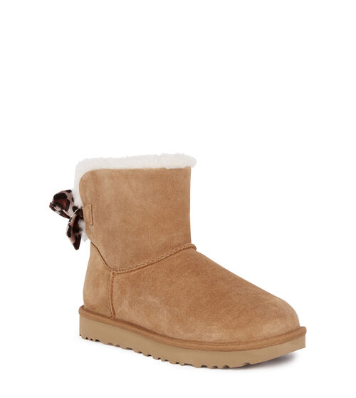 UGG Women's Mini Bailey Bow Velvet Leopard in Chestnut, Size 3