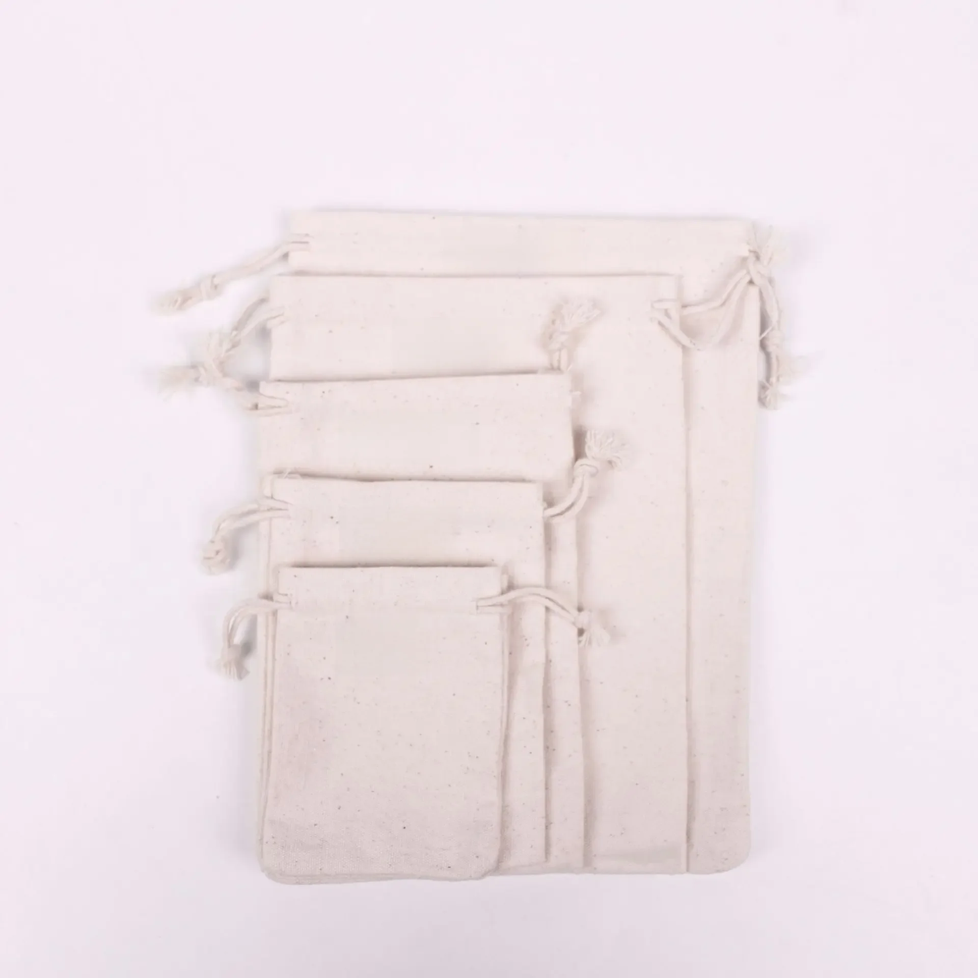 100pcs/Lot Natural Cotton Bags 7x9 9x12 10x15 13x18 15x20cm Drawstring Gift Pouches Home Storage Sacks Packing Bag Custom Logo