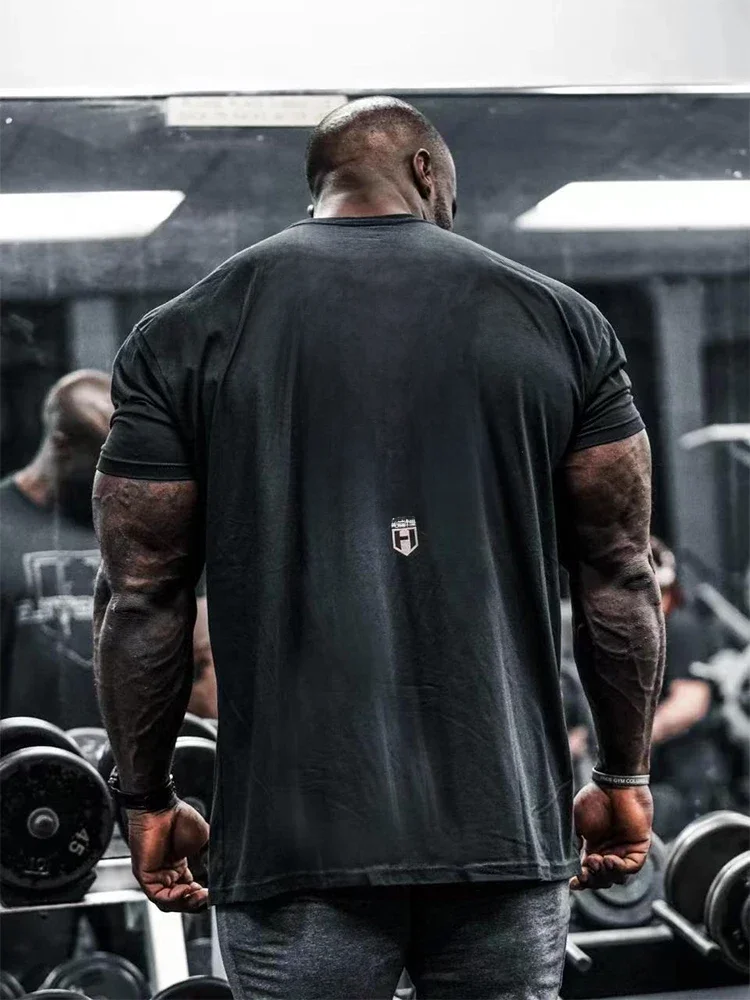 HOSSTILE Short Sleeved Fitness American Loose Muscle Tough Guy Top Breathable Sports Arnold Classic